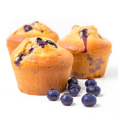 Muffins with blueberry on white background