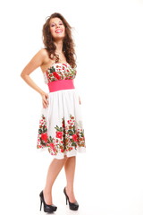 Fashion young woman in summer dress on white
