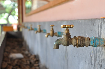 Many brasses water-tap in sink