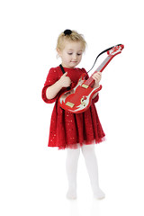 Strumming Her Toy Guitar