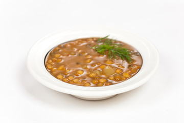 Lentil soup with vegetables in the plate