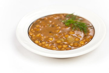 Lentil soup with vegetables in the plate