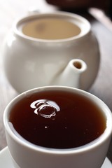 Hot tea on the wood background