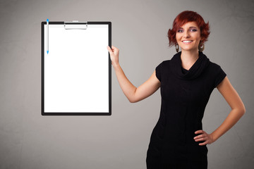 Young girl holding black folder with white sheet copy space