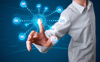 Businessman pressing virtual messaging type of icons
