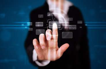 Woman pressing high tech type of modern buttons