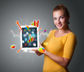 woman holding modern tablet with colorful diagrams and graphs