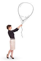 Pretty woman holding balloon drawing