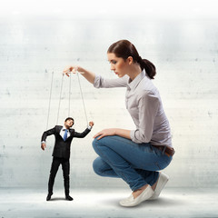 Businesswoman puppeteer