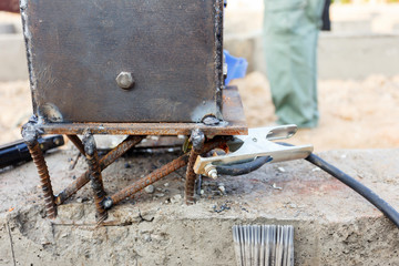 welding metal and wood by electrode with bright electric arc