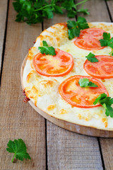 pizza with tomatoes and mozzarella