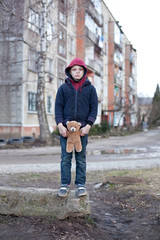 homeless boy with bear