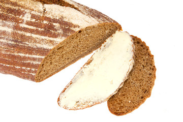 black homemade sliced bread with butter
