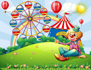 Obraz na płótnie Canvas A clown at the hilltop with a carnival