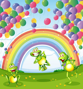 Three frogs under the floating balloons near the rainbow