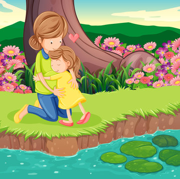 A mother hugging her daughter at the riverbank