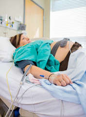 Pregnant Woman With Fetal Monitoring Belts