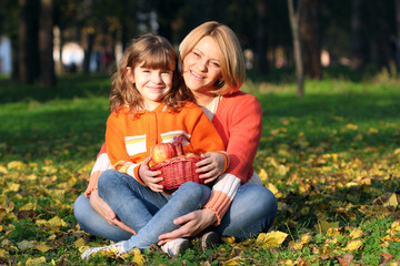 happy mother and daughter in park