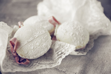 Cupcakes decorated with ribbon and lace on plate