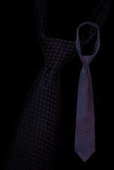 Two classical silk ties with dot pattern, on black