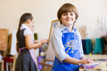 Cute boy painting