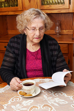 Senior With Tea Reading