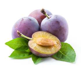 Plums and a half with leaves