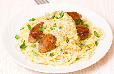 spaghetti with sausage and sauce