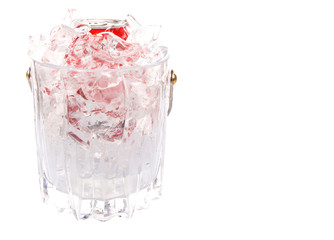 A can of cola drinks in an ice bucket