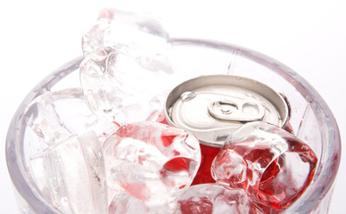 A can of cola drinks in an ice bucket