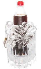 A bottle of cola drink cooled with ice cubes