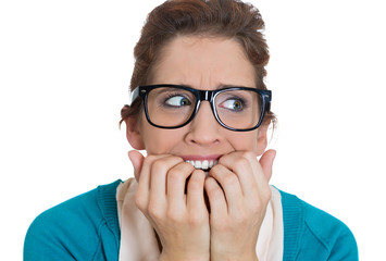 Stressed, anxious young woman biting fingernails