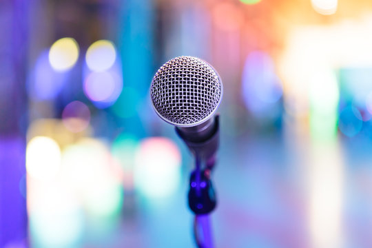 Detail of microphone with blurred party lights