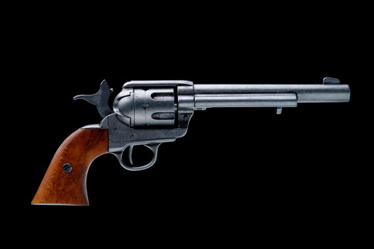 revolver pistol isolated on a black background