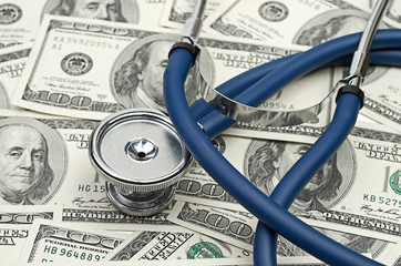 heap of dollars with stethoscope