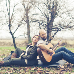 couple in love playing serenade with guitar