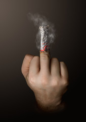 stop smoking concept. cigarette like a middle finger