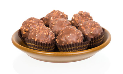 chocolate candy in tartlet form on white