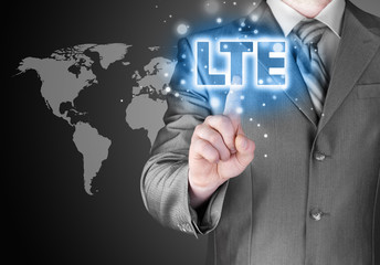 businessman is pushing his finger on lte button