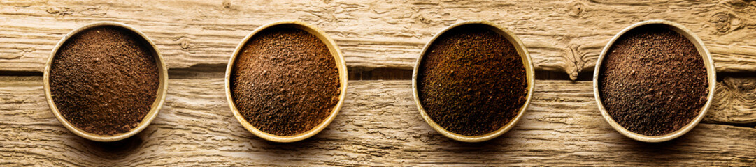 Varieties of freshly ground coffee powder - obrazy, fototapety, plakaty