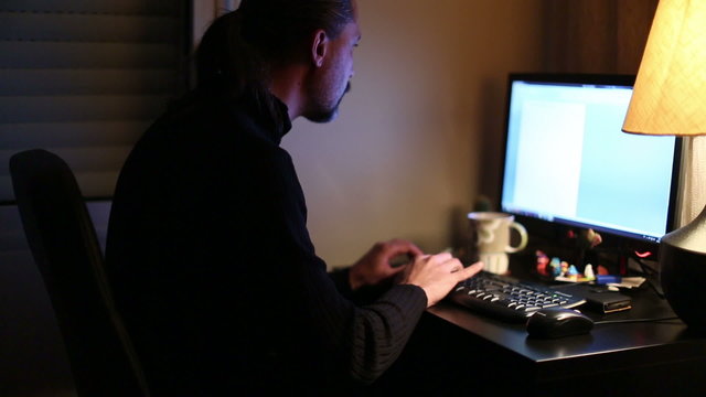 Man Working Computer At Home Office Night Time