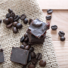 Chocolate pieces tower on a wooden surface