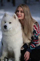Beautiful young girl with a dog Huskies