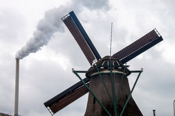 Factory chimney and wind mills near Zaanse Schans, Netherlands
