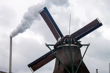 Factory chimney and wind mills near Zaanse Schans, Netherlands