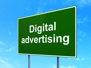 Marketing concept: Digital Advertising on road sign background