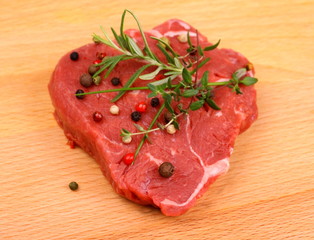 Juicy beef steak with spices and herbs