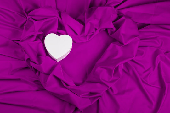 love card with heart on a purple fabric
