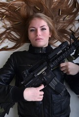 Fototapeta premium beautiful sexy girl holding gun