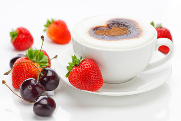 cappuccino in a cup in the shape of hearts,cherry  and strawberr